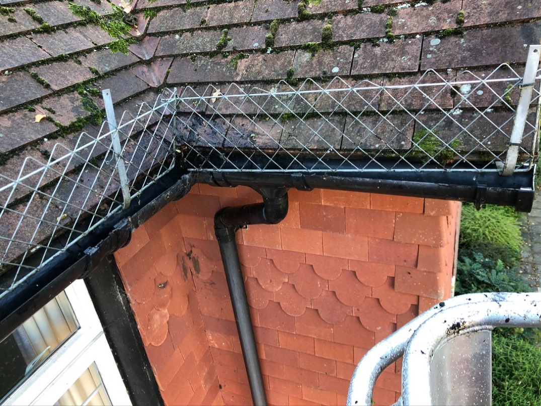 Downpipe fully cleared after professional gutter cleaning service